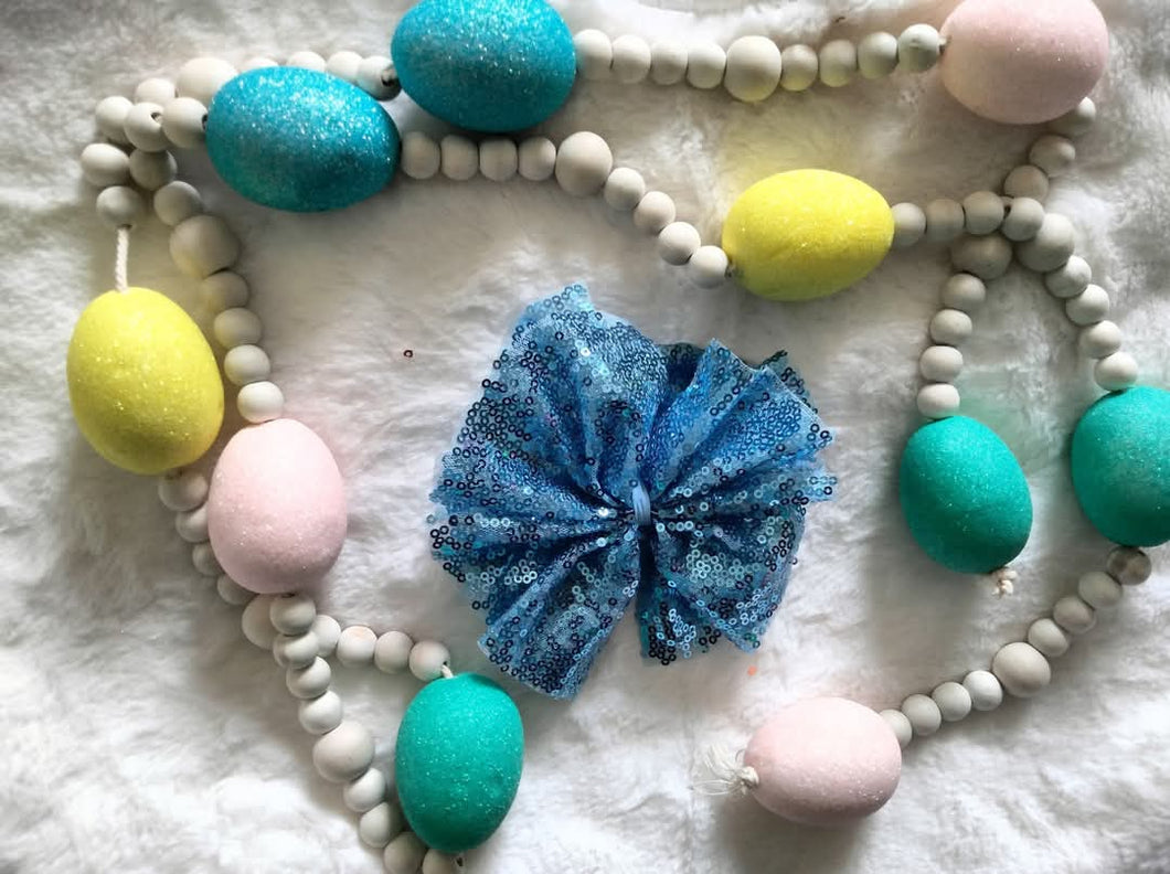 Blue sequin shredded bow
